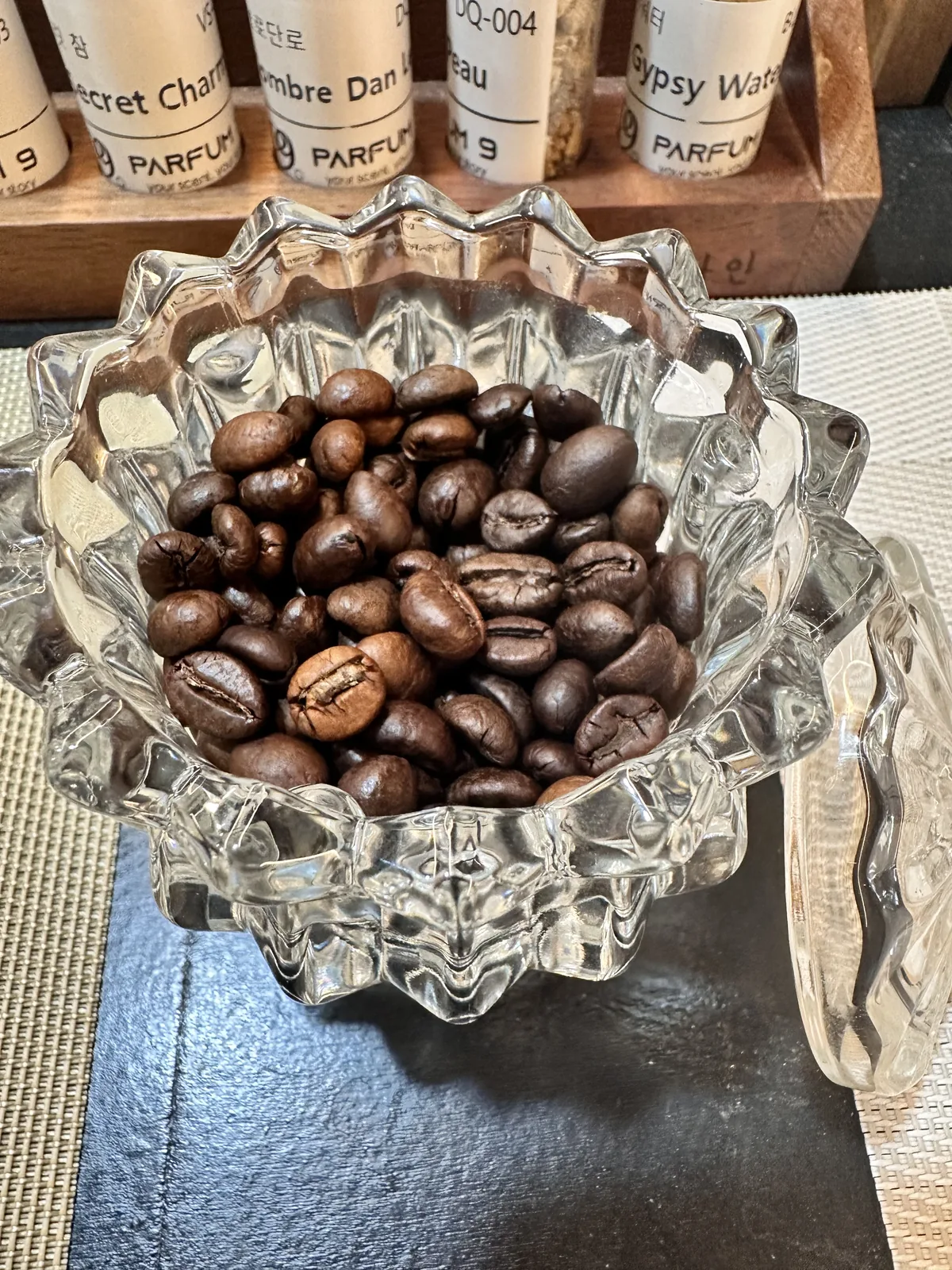Coffee beans used during fragrance testing at a perfume workshop